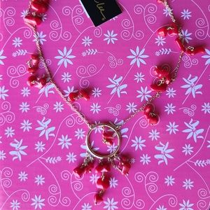 Gold chain necklace with coral stone bead accents